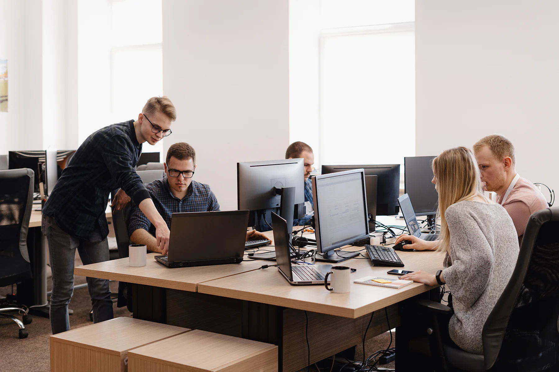 The VELDYX team working at their desks